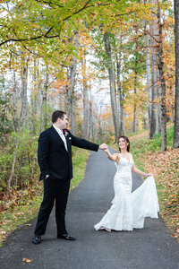 Bride and groom on path at Saratoga National Golf Club, NY