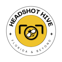 Badge with the text "Headshot Hive" at the top and "Florida &amp; Beyond" at the bottom on a circular border. A yellow circle features a stylized camera icon and bee, symbolizing our expertise as your Jacksonville headshot photographer. Black stars adorn each side between the texts.