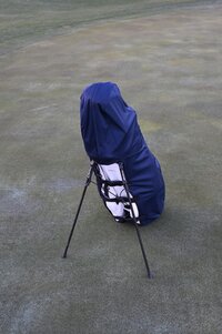 Water resistant golf bag cover by Over Armor Golf standing on golf course