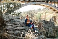 woman on rock smiling