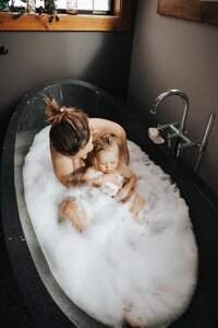 mother and baby in bubble bath