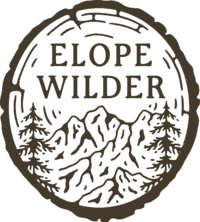 Wood round that says Elope Wilder