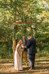 Indiana elopement packages include documenting a happy elopement ceremony in the woods