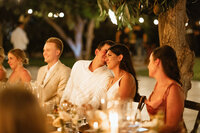 bride and groom listen to toasts