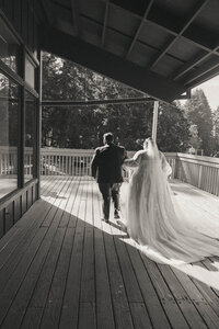 Brides walking away from the camera, representing  a wedding coordination by Birdie June Events.