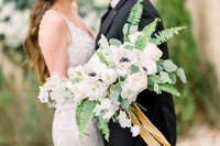 Couple with bridal bouquet during ceremony