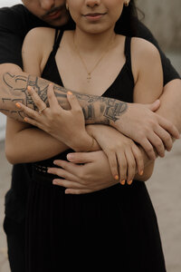 Couple sharing a sweet moment by the waterfront in Ontario