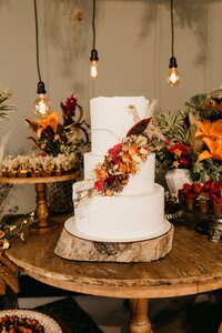 rustic wedding cake with orange florals