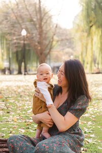 Mom holding baby taken by family photographer boston ma​