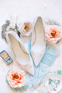 Wedding Photographer in Newport, RI, CT, and beyond | The Corteses | Flat lay with bridal heels, pink florals, and dusty blue colors