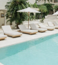 Woman painting and smiling at a painting workshop in Bali at a Holy Rest Retreat