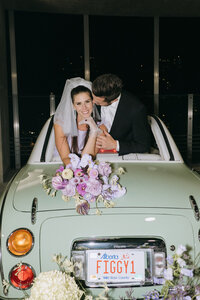 80’s inspired downtown elopement with violet florals and a vintage car, featured on the Brontë Bride Blog.