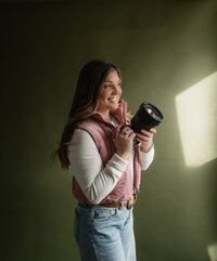 Self-portrait of a Wyoming-based wedding and lifestyle photographer, capturing a professional and artistic shot