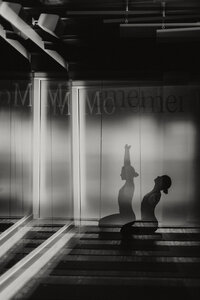 Cinematic black and white branding photography featuring a yoga practitioner in fluid movement, captured with intentional motion blur. Artistic and storytelling personal branding session for wellness entrepreneurs on the Sunshine Coast.