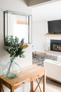 A white brick fireplace in a modern living room