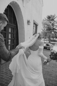 Bride Walking Away From Cam holding her husbands hand
