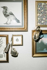 wedding shoes hanging on picture frames at The Ramble Hotel