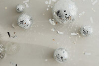 kaboompics_new-years-eve-party-mess-confetti-disco-balls-29267