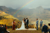 bride and groom just married mountain back drop