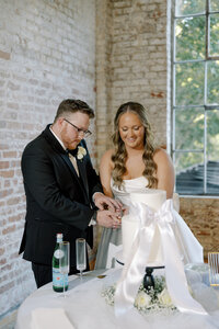 Cutting the wedding cake at the Bakery Building in Hattiesburg, Mississippi.
