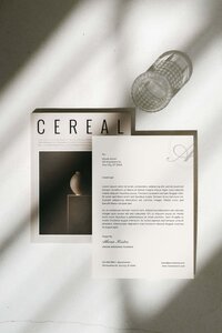 Athena Kristen wedding planner branded letterhead stationery mockup with elegant serif typography, soft shadows, and editorial styling alongside Cereal magazine.