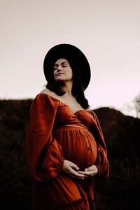 Pregnant mother enjoying the Fall season captured by Canton, GA maternity photographer.