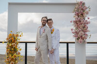 Grooms posing during wedding portraits at LGBTQ wedding