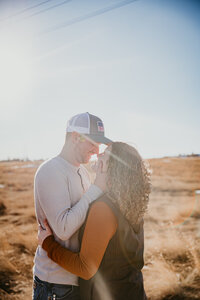 Engagement photo session in Colstrip, MT, featuring a couple in a stunning outdoor setting, capturing intimate moments against Montana’s wide-open landscapes and natural beauty, perfect for adventurous couples.