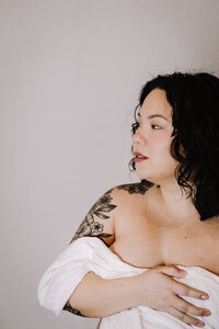 A women wrapped in a white sheet.