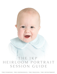 Baby smiling posing for heirloom photography in heirloom clothing