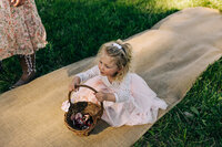 flower girl on burlap aisle runner