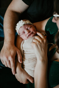 A sweet and intimate newborn session in Laurel, MT. The newborn baby is captured in their earliest moments, enveloped in warmth and love, creating lasting memories for the family to cherish forever.