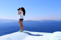 Photographer taking photo in Santorini, Greece
