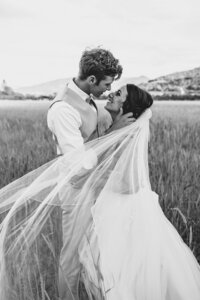 wedding couple kissing with veil