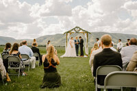 Natalie Dyer of Natalie Dyer Photo capturing a wedding moment in Wyoming, showcasing candid and artistic photography.