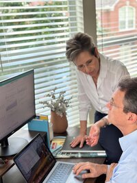 Expert financial advisors in Dallas working at their financial office. The image showcases their professional environment, reflecting their expertise and commitment to providing top-notch financial advice.