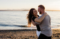 boyfriend and girlfriend celebrate getting engaged at edmonds waterfront park