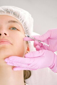  Aesthetic injection treatment demonstrating cosmetology expertise for medical spa copywriting and Thermage content marketing