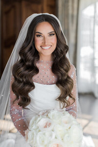 Experience radiant curls crafted by our skilled Philadelphia bridal hairstylist.