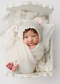 Newborn baby photographer in Syracuse new york posed so sweetly as a baby bear