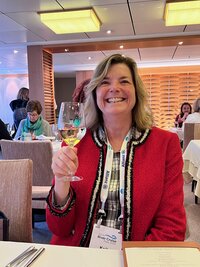 Photo of Kelly Holding a Wine Glass Smiling