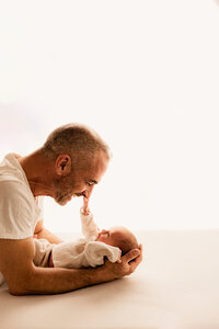 Phoenix newborn photographer near me dad and baby posing in newborn session