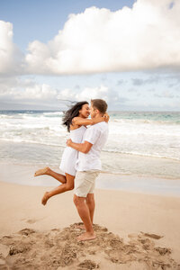 Maui Wedding Photographer captures man lifting woman and spinning her around