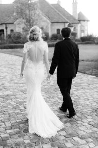 Bride and groom walk up memorial steps at their DC wedding