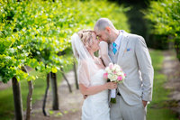 bride and groom pose for closeup portrait