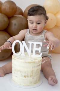 Toddler with birthday cake