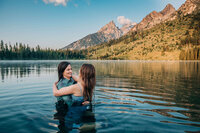 engagement-portrait-stainding-in-lake-Jackson-Hole-Family-Photographer-Jenna-Boshart-Photography