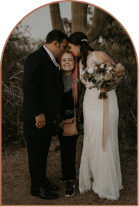 Arizona bride and groom kissing the head of wedding photographer