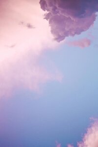 Photo of sky with clouds. Purple hue, dreamy vibes
