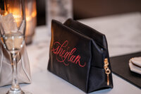 Close up of cosmetics bag with custom calligraphy